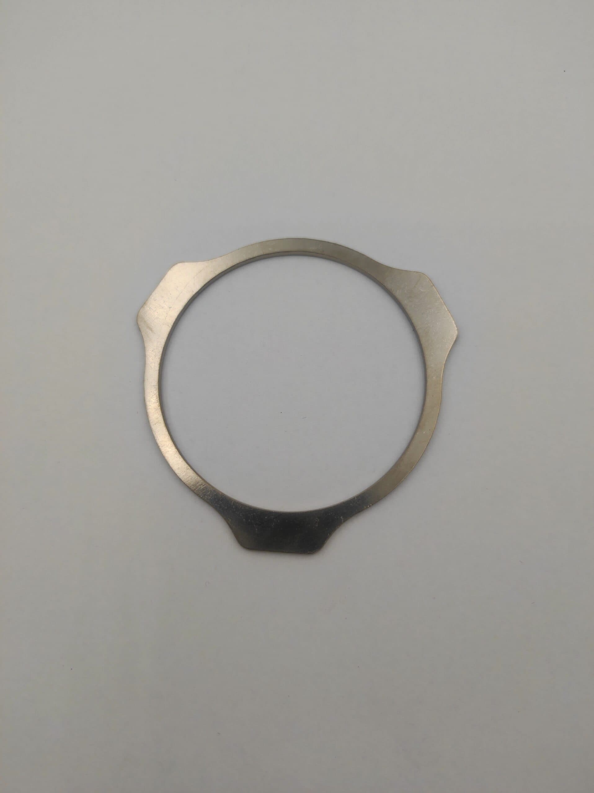 Podkładka zabezpieczająca półoś Case 580SLE